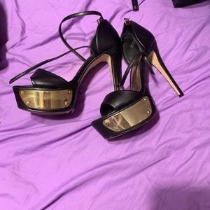 Black and gold stilettos
